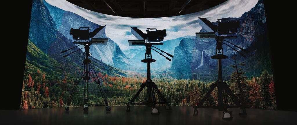 ikan broadcast turnkey solution that includes a teleprompter, pedestal, and dolly, in front of an LED volume for virtual production