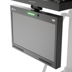 Angled side view of the Ikan M19W-NDI 19-inch teleprompter monitor showing the NDI logo displayed on the screen, green tally light illuminated on top, and visible control buttons at the bottom.