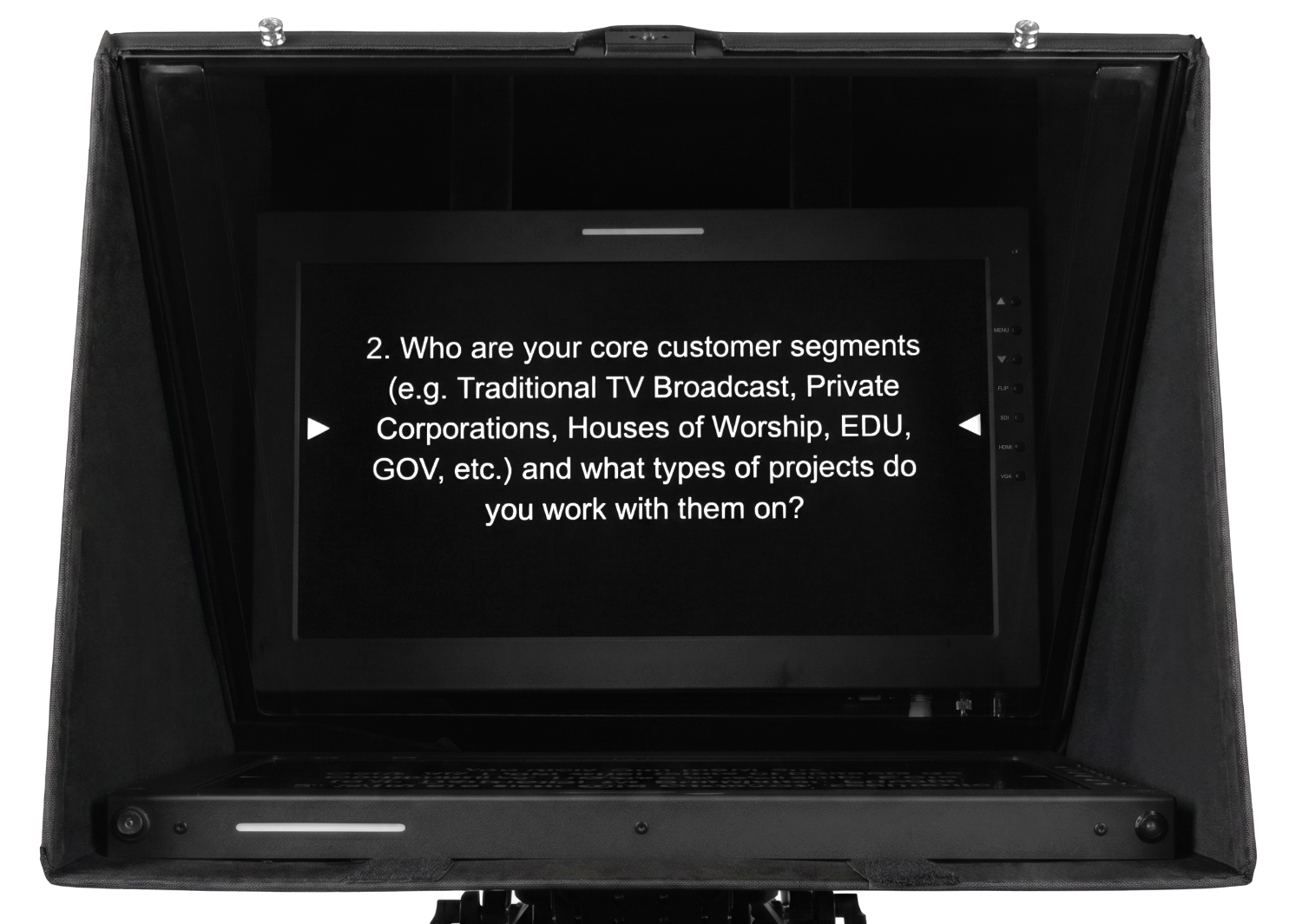 3 PT-SH Web Version talent reading from ikan teleprompter with PT-SH shade hood blocking ambient studio light, glare-free teleprompter glass in bright studio environment